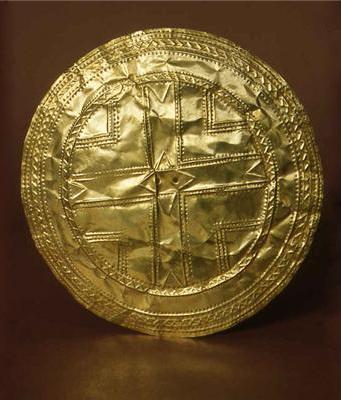 Gold Disc,  Teldavnet, Co Monaghan. In this Gold Disc you can see just how thin the gold has become from being hammered- its like gold foil. You can also see the two holes in the centre which were used to fasten the gold disc using gold wire.